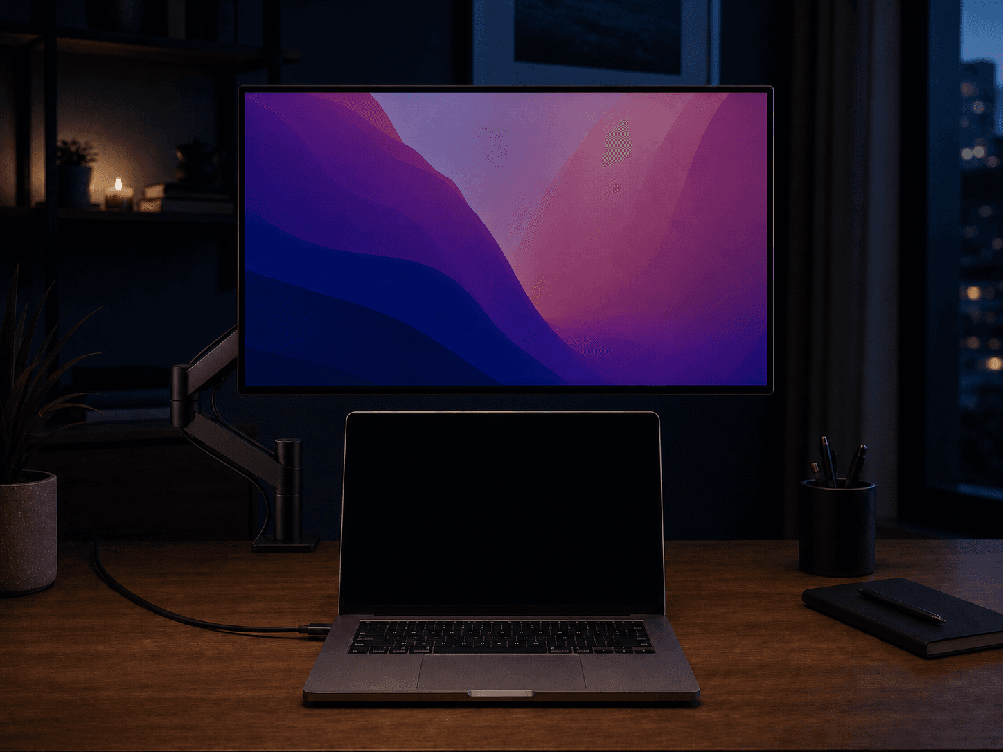MacBook open with its built-in display off while an external monitor remains active